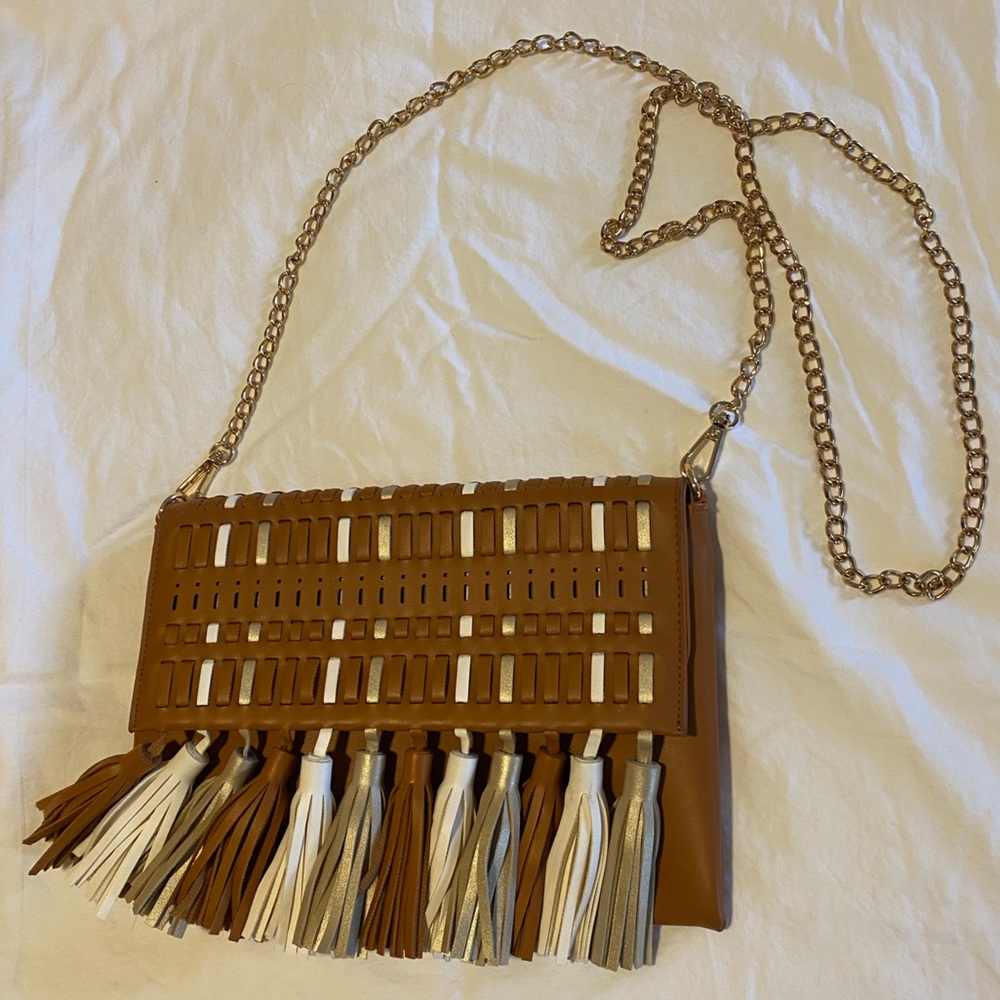 Faux leather cross body bag with good and white fringe tassels